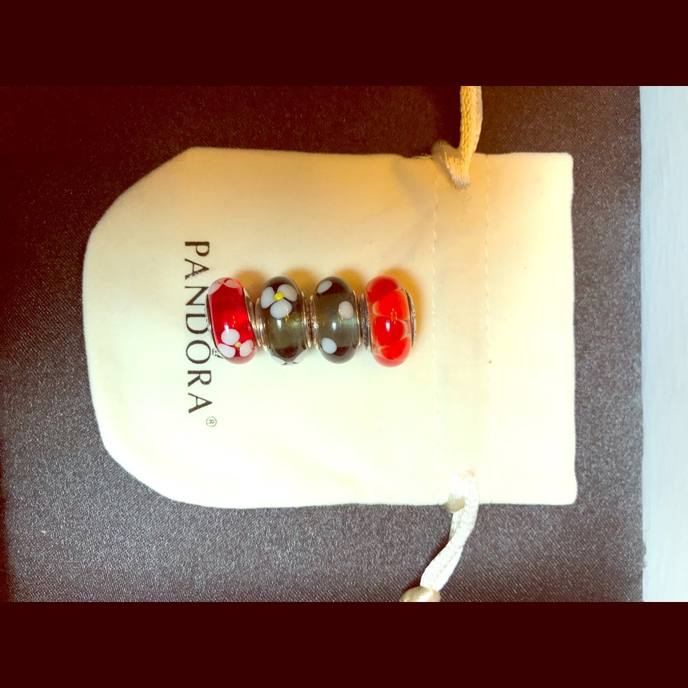 Four authentic Murano Pandora glass charms